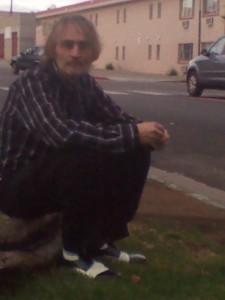 Dale Kellams sitting on a curb